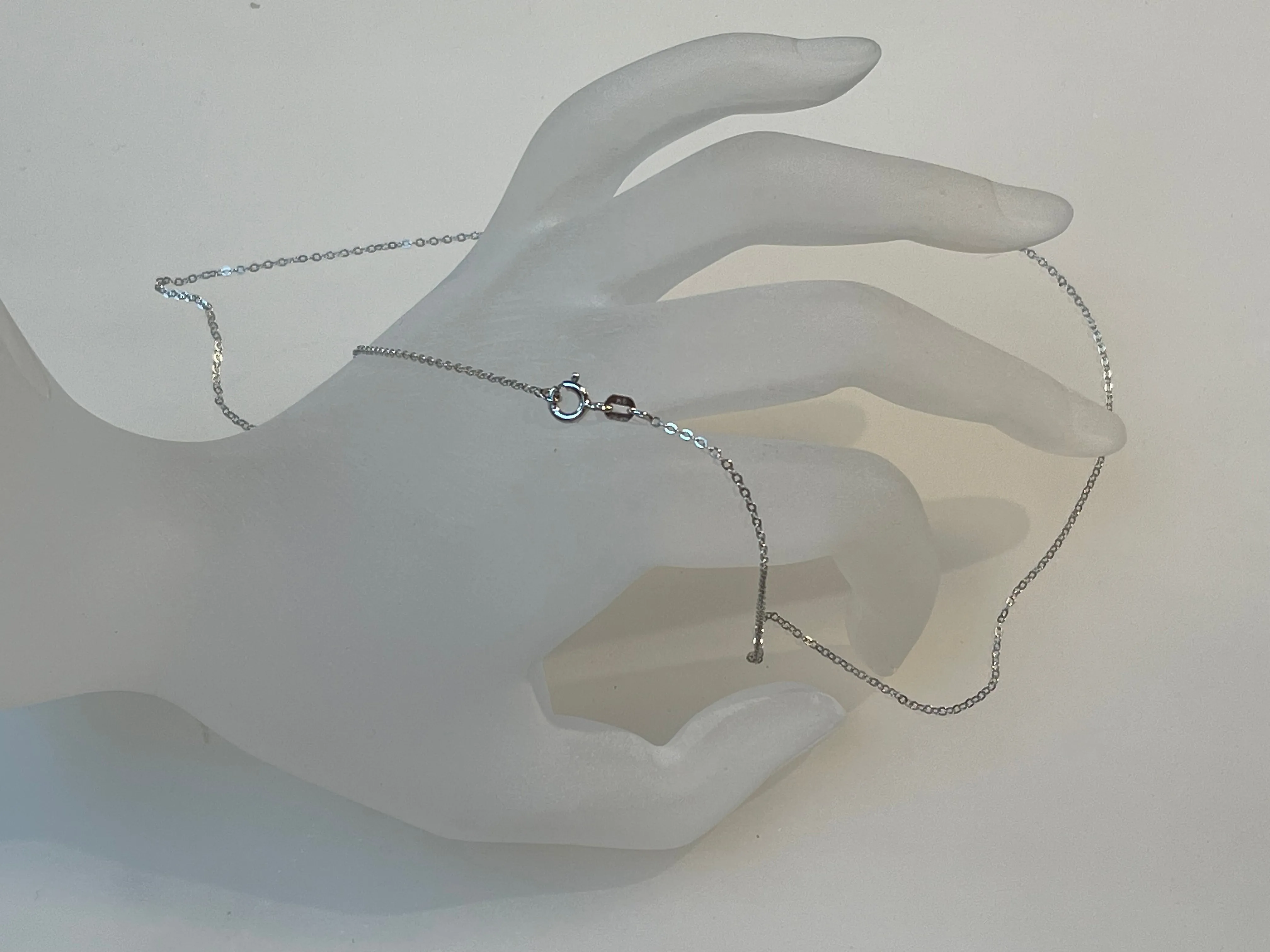 16, 18, and 20-inch slender Italian 925 sterling silver Diamond-Cut cable chain with spring ring clasp. Rhodium Plated.