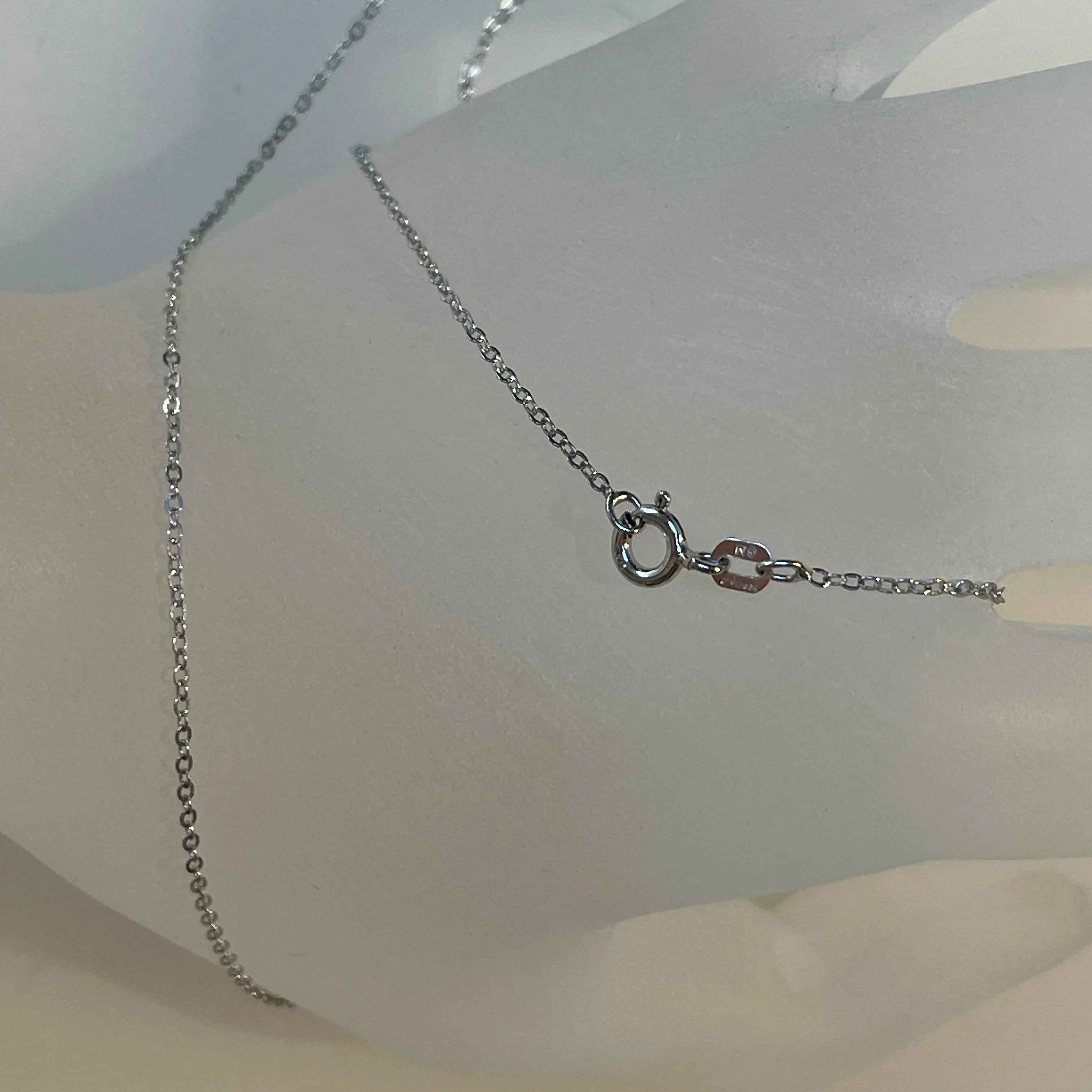 16, 18, and 20-inch slender Italian 925 sterling silver Diamond-Cut cable chain with spring ring clasp. Rhodium Plated.