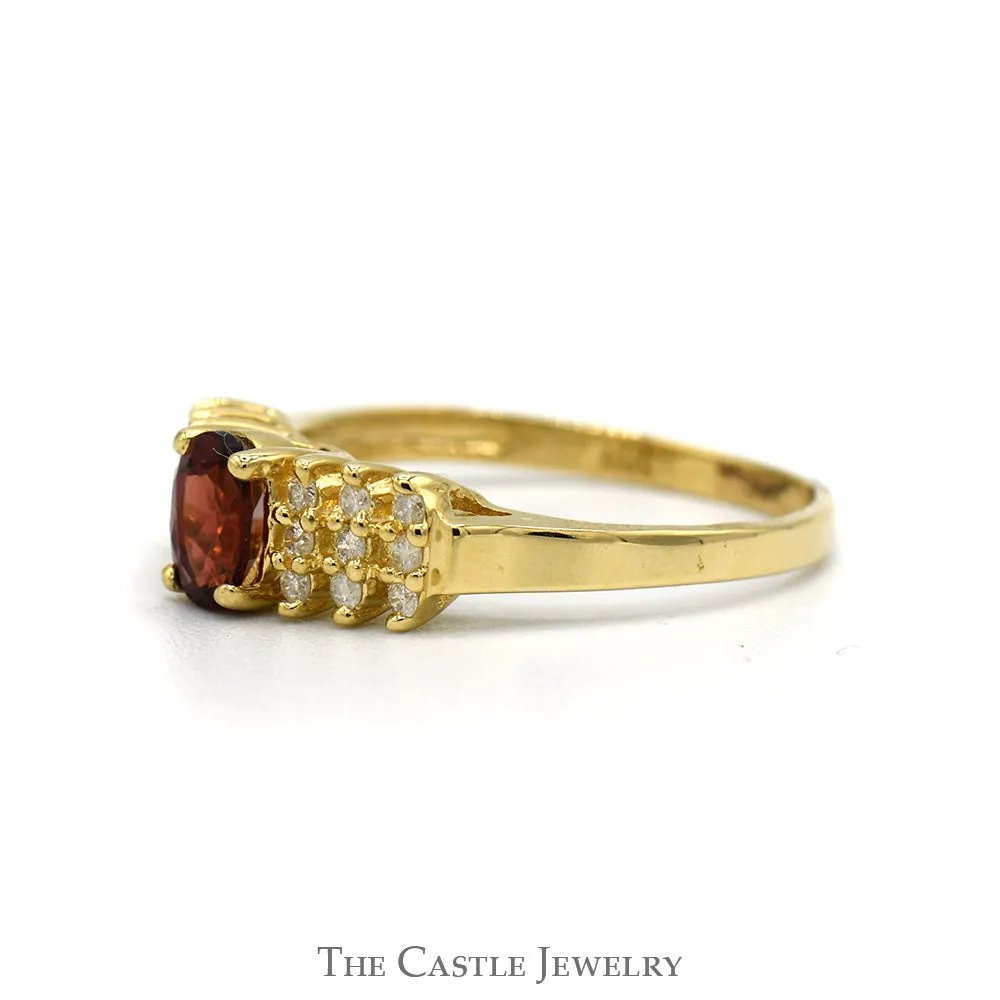 Oval Cut Garnet And Diamond Ring With  .18 CTTW Diamonds In 14KT Yellow Gold