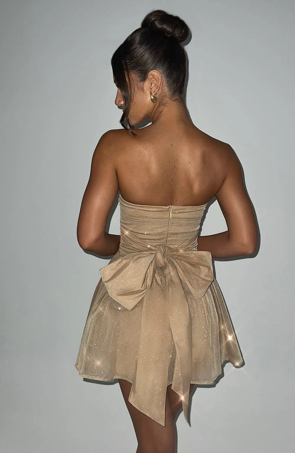 Rubí® | Strapless, sparkly dress with a button placket at the back