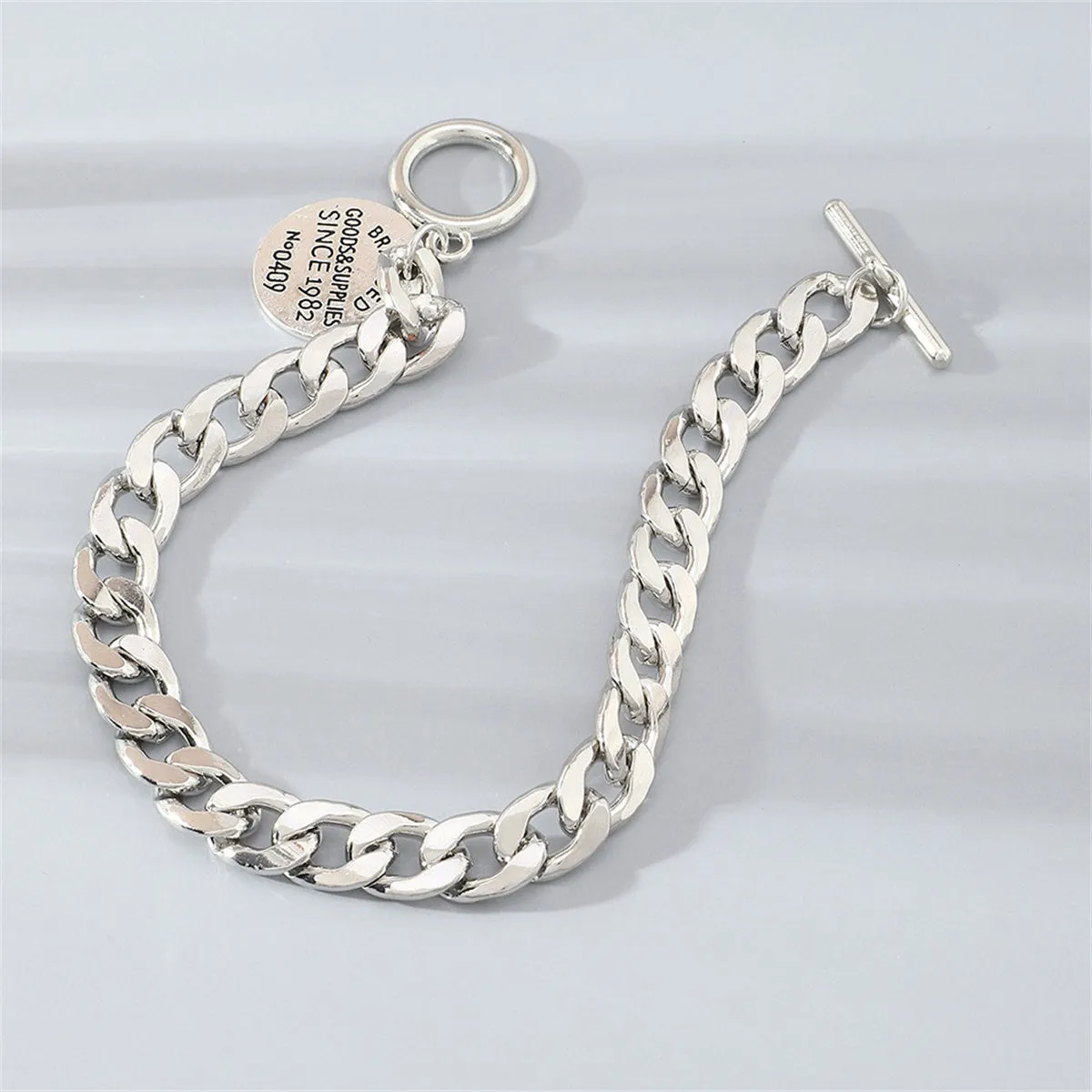 Silver-Plated 'Goods & Supplies' Curb Chain Toggle Bracelet
